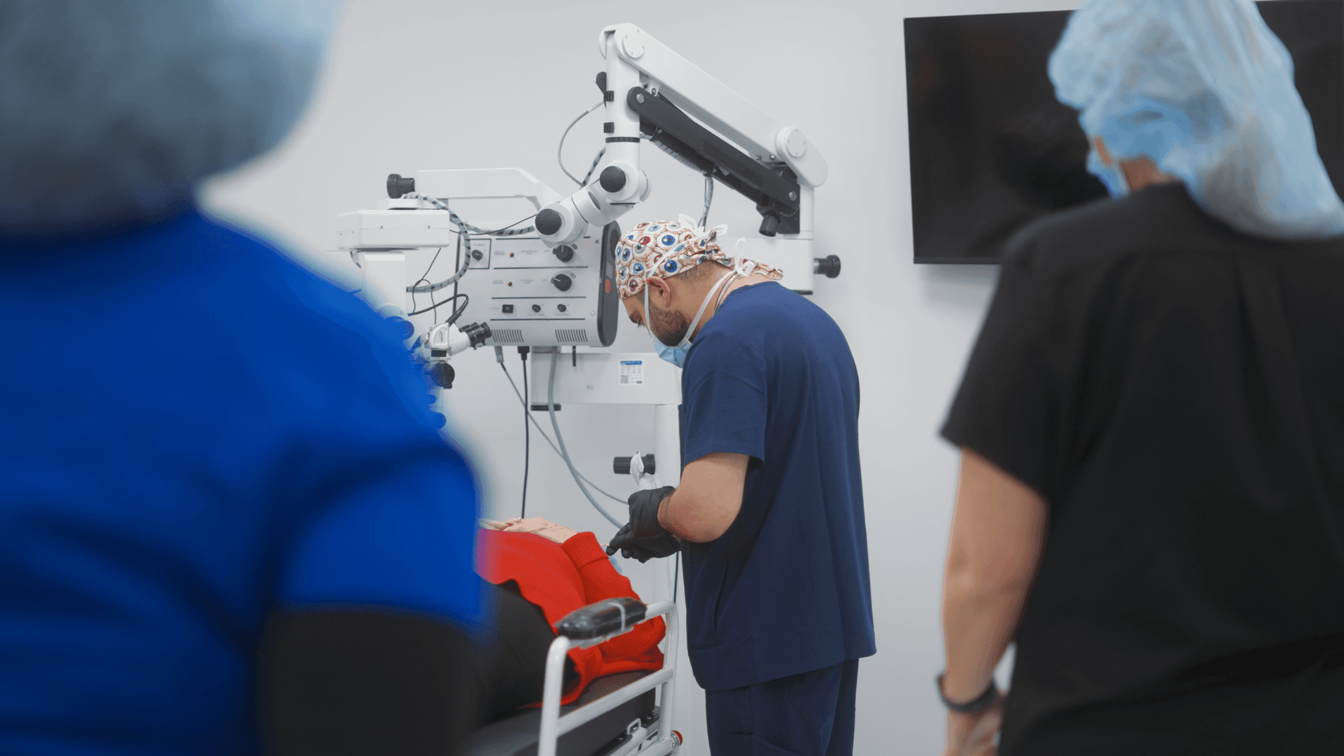 Dr. Shehzad Batliwala performing eye surgery in the operating room
